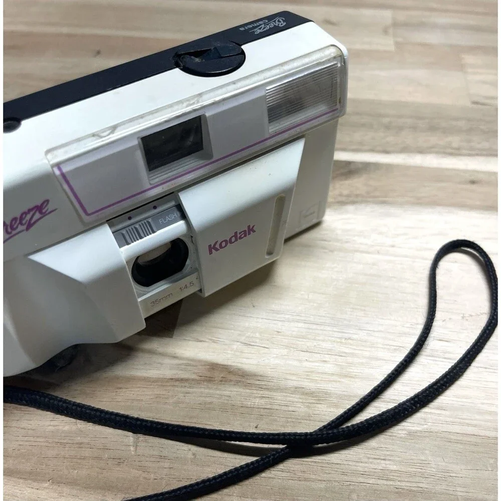 Kodak White Breeze Point-and-Shoot Camera with Black Strap and Pink Accents